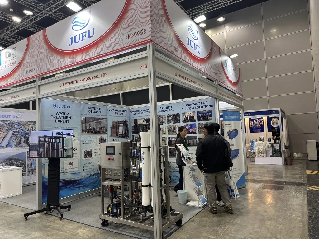 Visitors speaking with the JUFU WATER team at ASIAWATER 2026