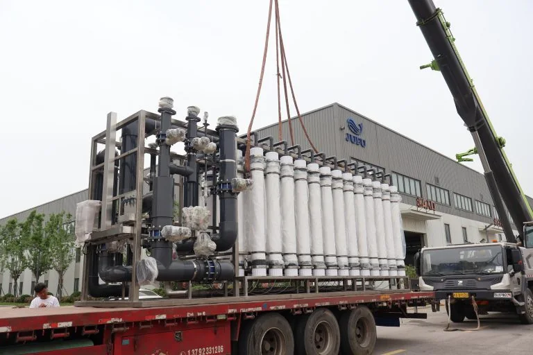 JUFU WATER treatment equipment being loaded for transportation